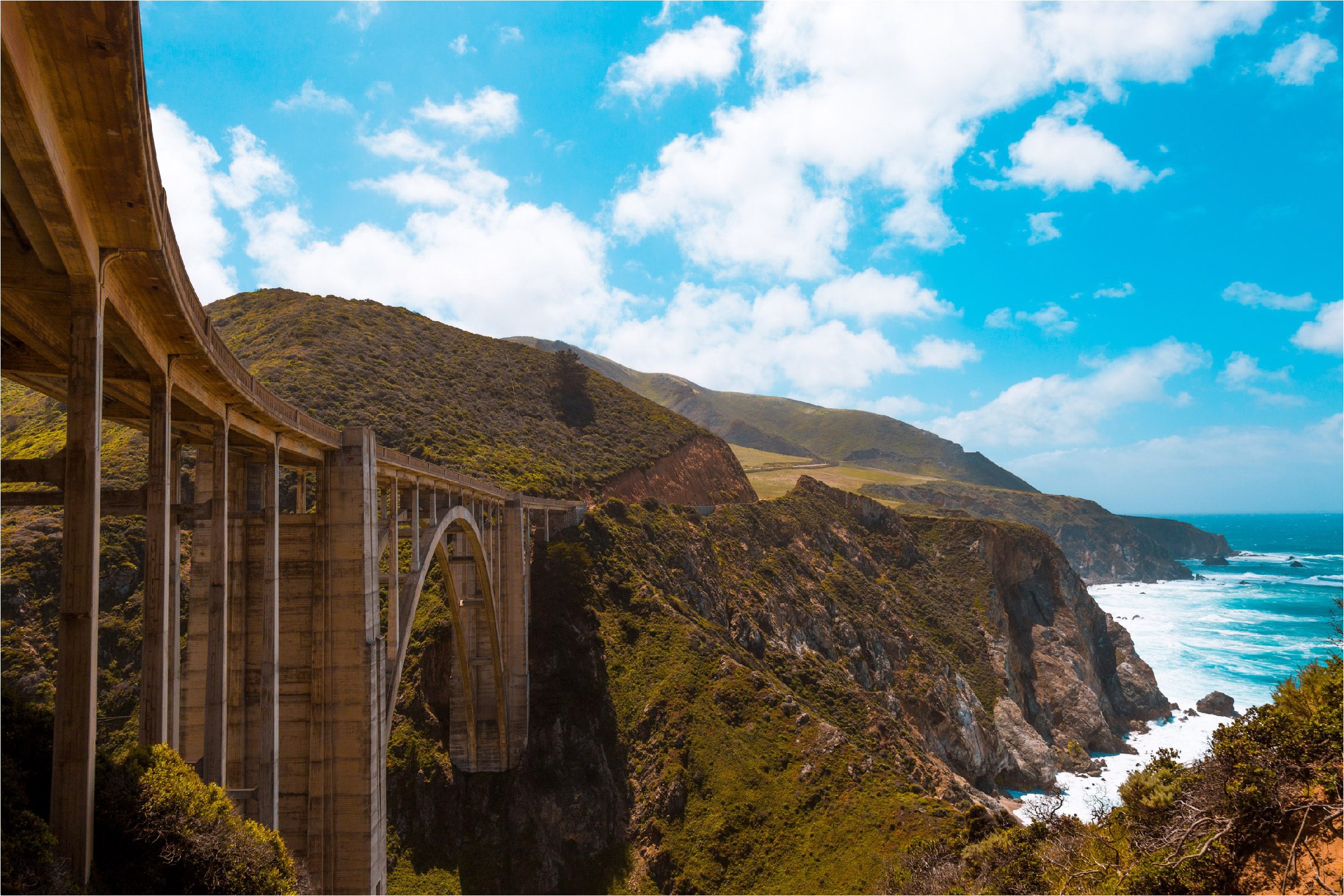 Big Sur with blue skies and a view of the Bixby Bridge.
