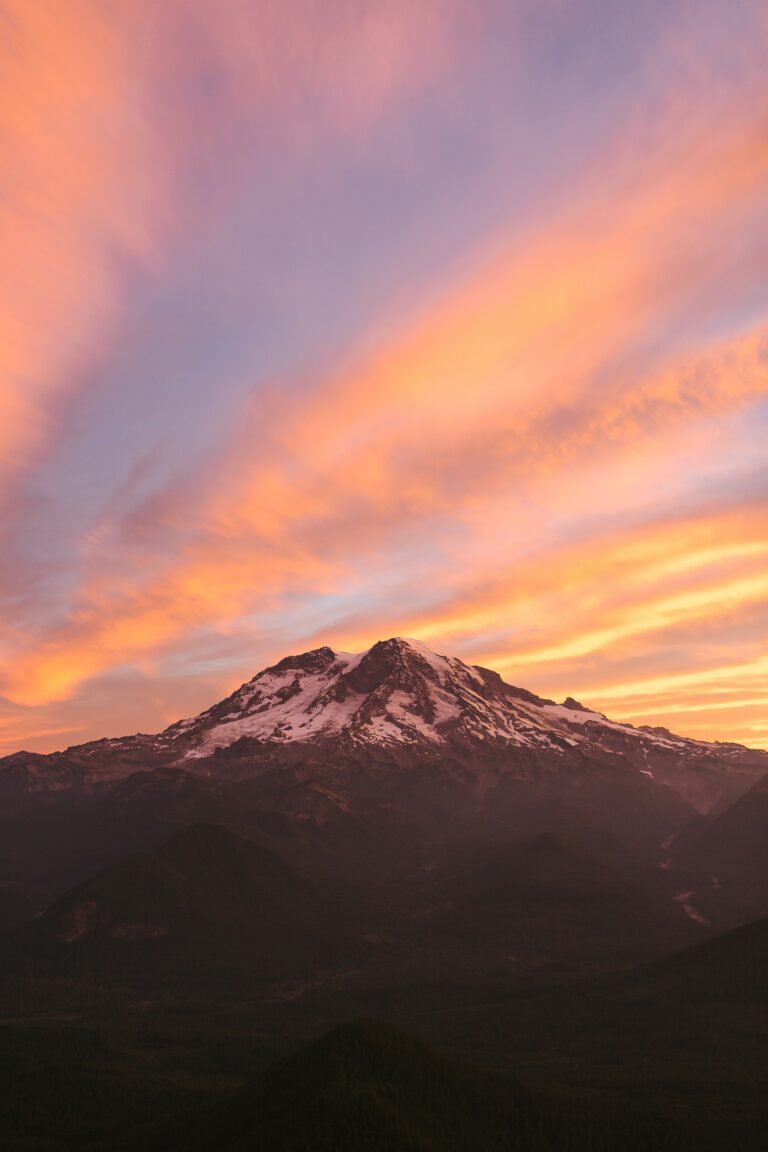 See Mount Rainier at sunrise on a Green Tortoise adventure in the Pacific Northwest.