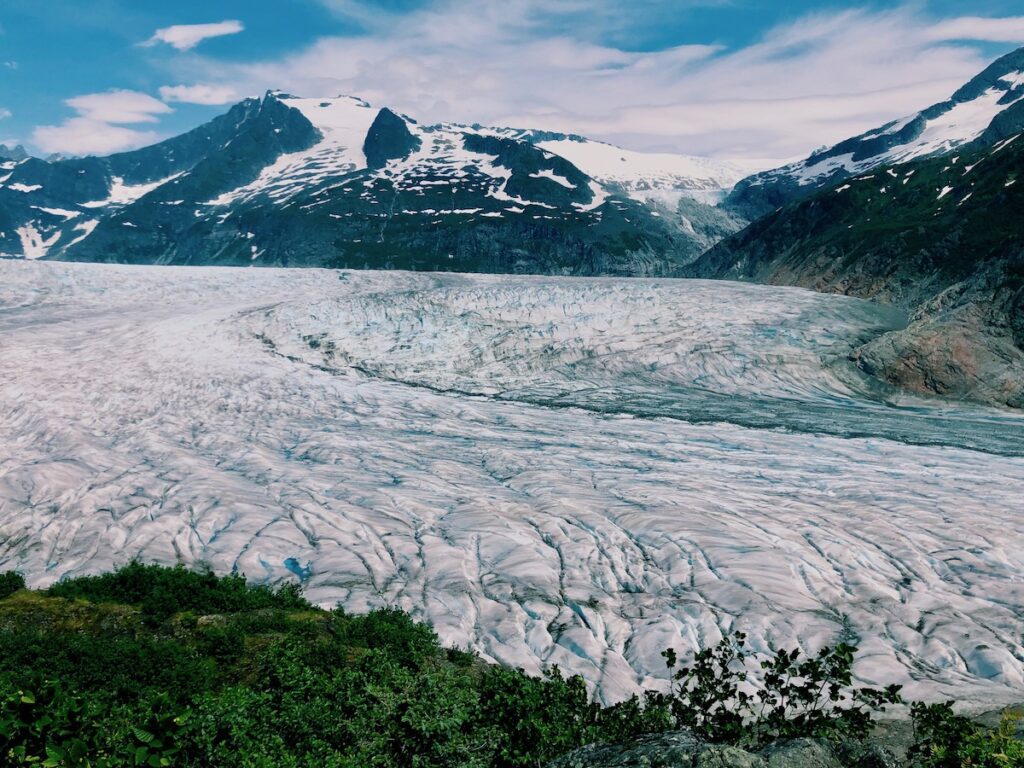 The Mendenhall Glacier stretches for miles beneath snow-capped mountain peaks.