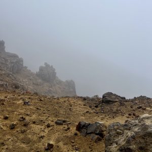 Fog hides the distant views on a rocky ridge on this day hike.