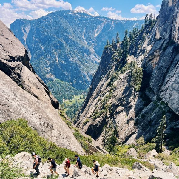 People hiking on a trail in Yosemite Valley