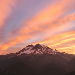 See Mount Rainier at sunrise on a Green Tortoise adventure in the Pacific Northwest.